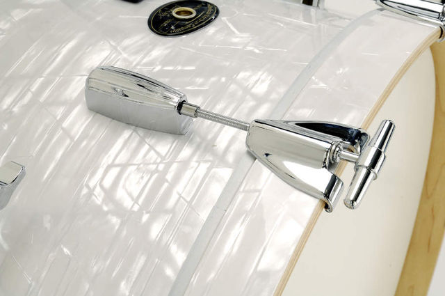 Both resonant and top heads are single-ply with a dense white coating